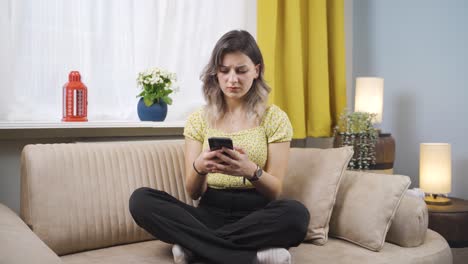 Disappointed-young-woman-texting.
